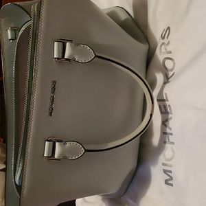 Preloved ice blue Michael Kors purse. With duster bag